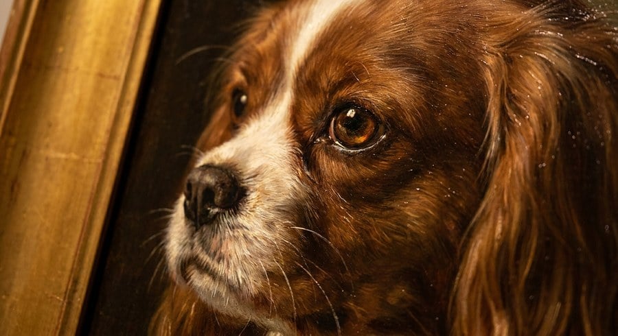 Close-up of a hand-painted portrait showing crisp detail